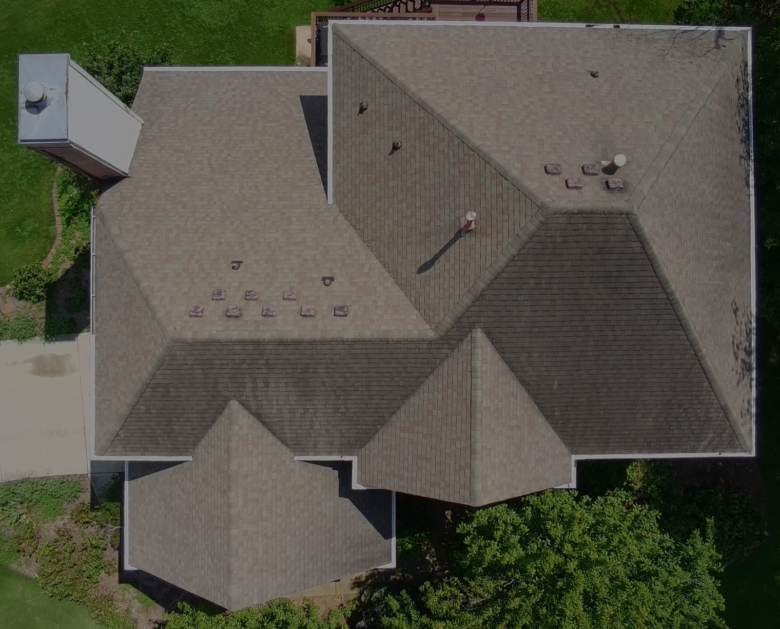 Storm-worn roof before replacement, aerial view